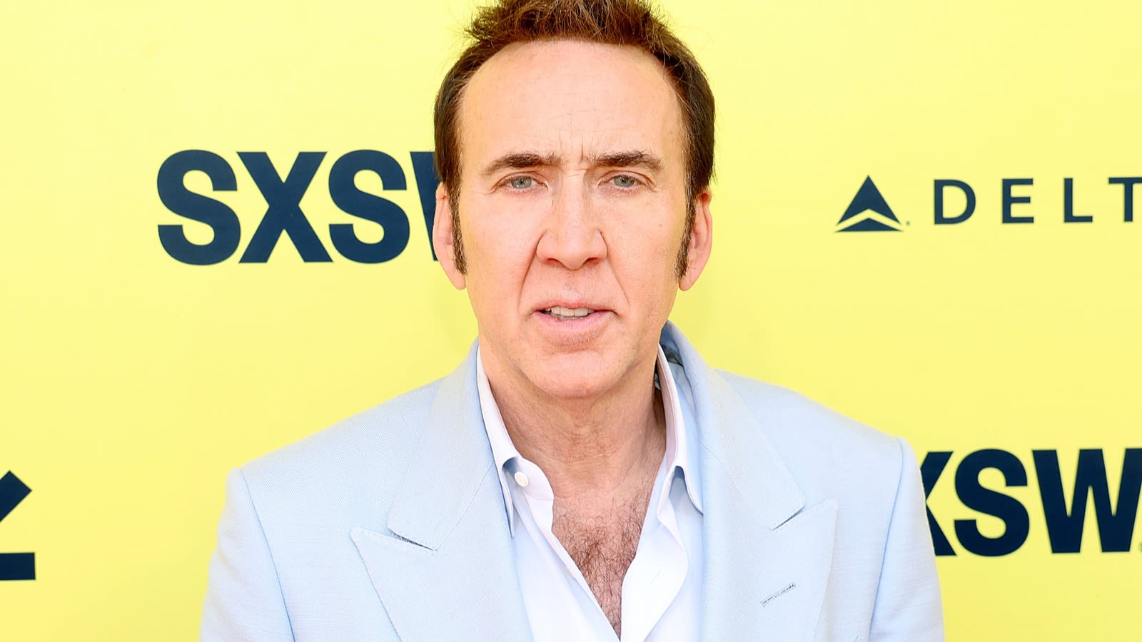 Nicolas Cage Appears In This Viral Image Of Two Girls With Pizza (If You Do It Right) - Looper