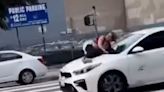 Watch: Dog owner clings to bonnet of moving car with her stolen bulldog inside