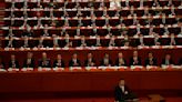 China's Xi calls for military growth as party congress opens