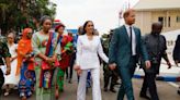 Meghan Changes Into a White Suit With Flared Pants for Second Engagement in Nigeria