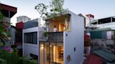 A team of architects designed a narrow, 13-foot-wide home that's big enough for a family of 4 and has a full-length glass wall — check it out