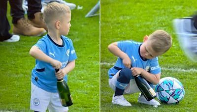 Adorable moment Phil Foden’s son, 5, tries to open bottle of champagne