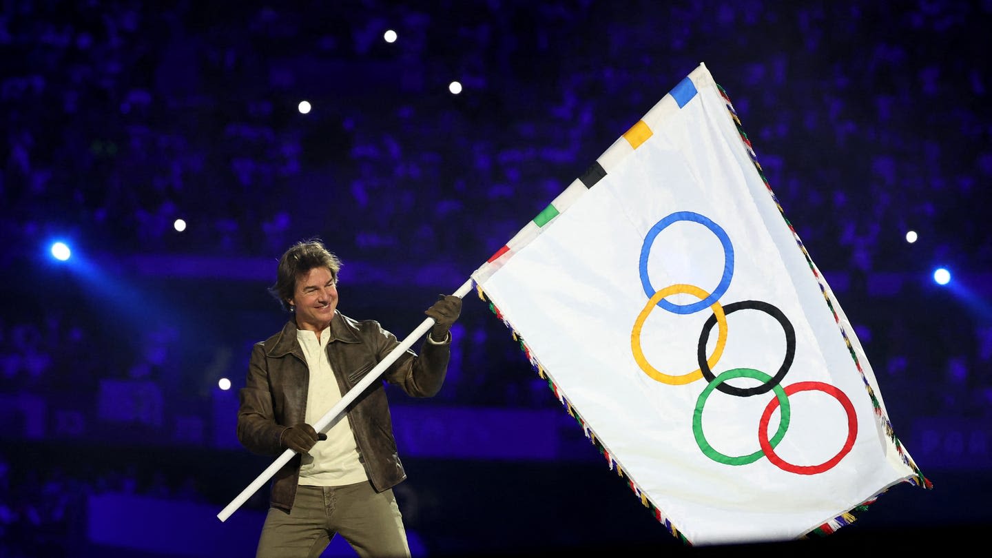 Tom Cruise’s Dive into the Paris Olympics Closing Ceremony Follows a Long History of Daring Stunts