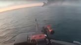 IDF video shows Israeli navy unit spraying machine gun fire at Hamas fighters 'swimming' toward coast