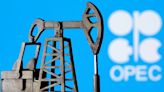 Oil prices settle higher global demand forecasts, US crude stock draw