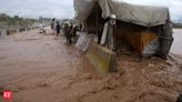 Flash flooding triggered by heavy monsoons in northwest Pakistan kills at least 14 people