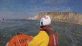 Watch: People cut off by tide rescued by lifeboat crews on hottest day of the year