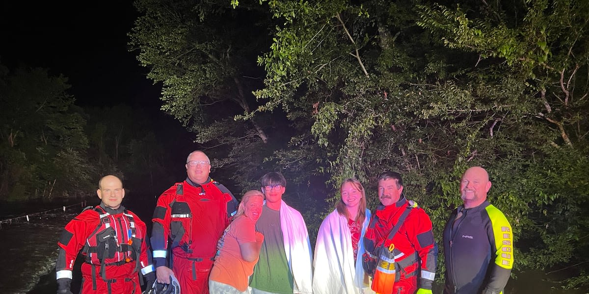 Nashville Fire Department volunteers rescue two people from floodwaters in Texas