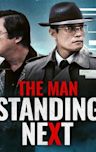 The Man Standing Next