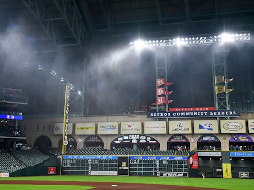 Water pours through Minute Maid Park's roof but the game goes on