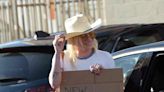 Kesha Holds Up Sign Teasing 'New Music Coming Soon' While at 7-Eleven in Los Angeles