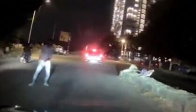 Startling dash cam video shows Bengaluru man jumping in front of moving car at night