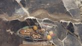 That's no pizza: A wall painting found in Pompeii doesn't depict Italy's iconic dish