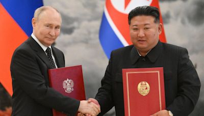 Putin and Kim Jong-un sign mutual defence pact in case of attack on Russia or North Korea