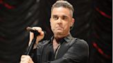Robbie Williams on Second Take That Reunion, Biopic ‘Better Man’: ‘What I Don’t Want To Do is Open Up Old Wounds’