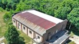 An Indiana couple spent 20 years turning a high-school basketball gym into a home. They're listing it for $299,000, and the agent says 'it still smells like a gym.'