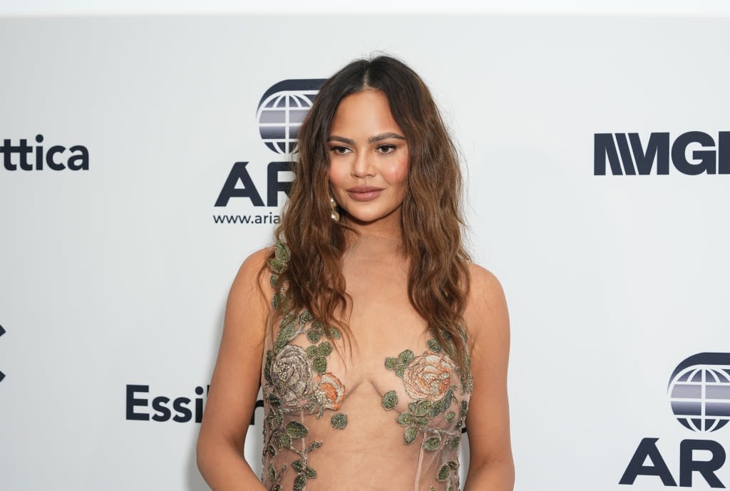 Chrissy Teigen Tried To Keep up With Daughter Luna — & Ended up in a Neck Brace