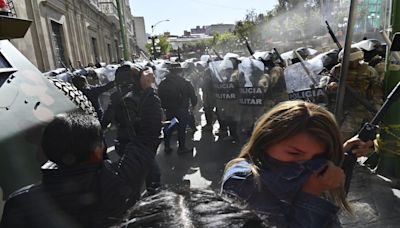 Bolivia’s president warns of coup attempt, detains its mastermind and restores his government