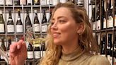 Amber Heard Smiles and Sips Champagne in Rare Photo to Celebrate Her 38th Birthday