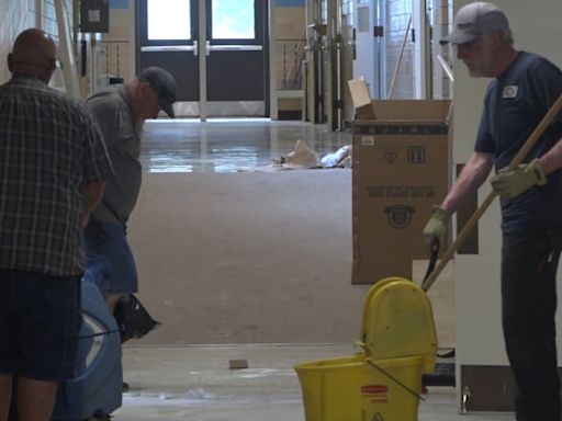 Community comes together to clean vandalized former elementary school