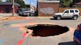 Massive Richmond sinkhole swallows car