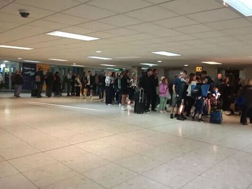 Glasgow Airport in chaos as hundreds of excited holidaymakers queue in car park