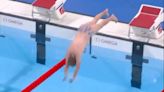 Olympics worker becomes hero as he strips to jazzy trunks to retrieve swim cap