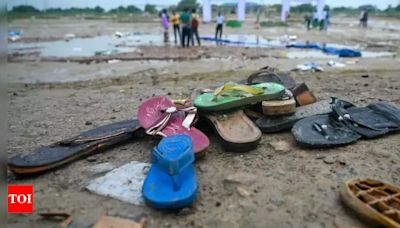 Hathras Stampede: Tragic Tales of Scattered Slippers and Shoes | Agra News - Times of India