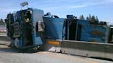 Garbage truck rolls over on southbound I-5 in Kent