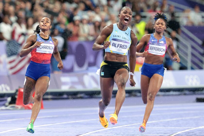 Julien Alfred upsets Sha'Carri Richardson to win women's 100 meters at Paris Olympics