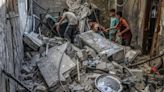 Dozens of bodies found in Gaza rubble as ceasefire negotiations continue in Egypt
