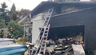 Crews cut holes in roof to fight house fire in Vancouver Saturday afternoon