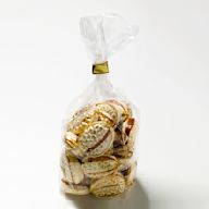 Durable and see-through plastic bags, perfect for displaying treats while keeping them protected. Commonly used for party favors or small gifts.