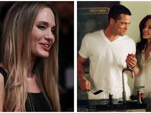 Angelina Jolie appears stoic as she autographs Mr and Mrs Smith poster featuring ex-husband Brad Pitt. Pics