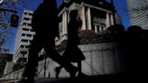 BOJ keeps rates steady, decides to lay out bond taper plan next month