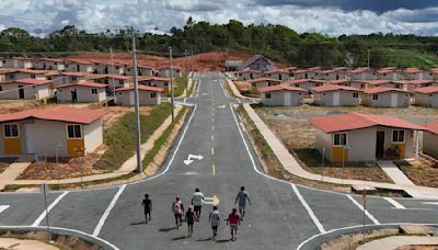 Panama community pushed from Caribbean island by rising sea levels moves into new houses