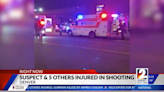 Five bystanders shot when Denver police open fire on man holding gun in crowded street