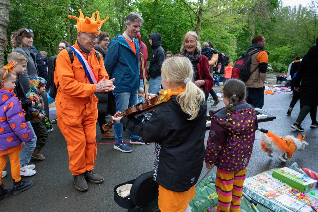 Orange crush: Boats packed with revelers tour Amsterdam canals to celebrate the king’s birthday