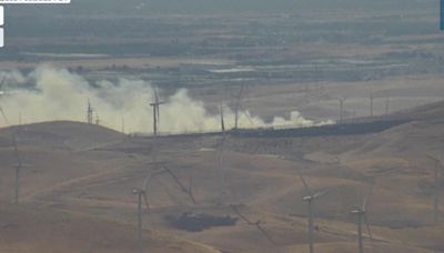 Firefighters battle 20-acre brush fire near Altamont Pass; forward progress stopped