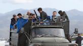 Exasperated residents flee Nagorno-Karabakh after Azerbaijan seizes control of breakaway region