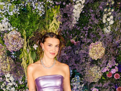 Millie Bobby Brown Is ‘Pool Ready’ in a Metallic Lavender Triangle swimsuit With Denim Shorts