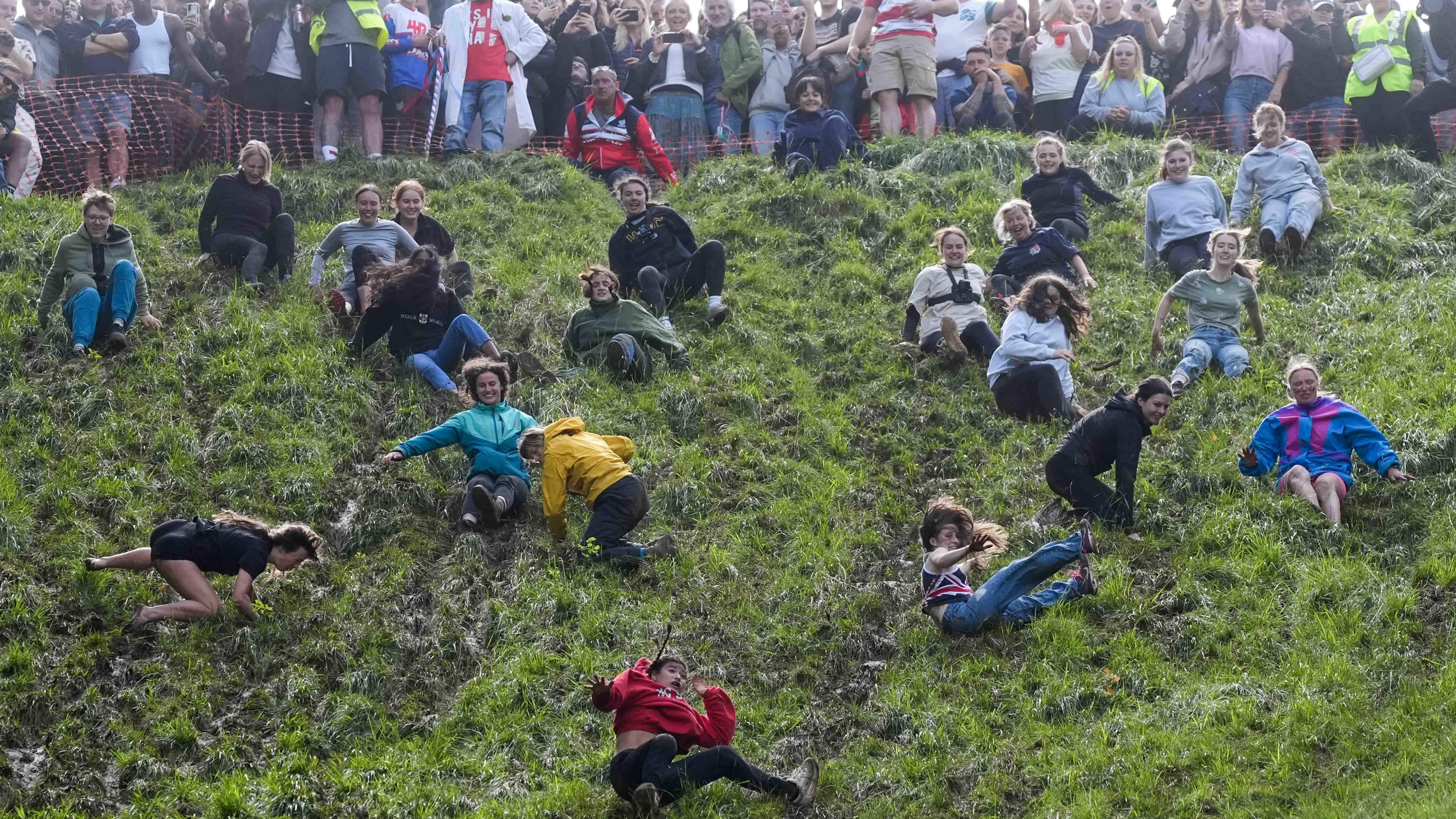 Daredevils defy weather for annual cheese rolling races