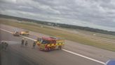 Gatwick chaos as firefighters seen hosing down plane on runway