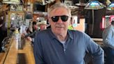 Real Madrid coach Carlo Ancelotti drinks in a saloon in Montana town