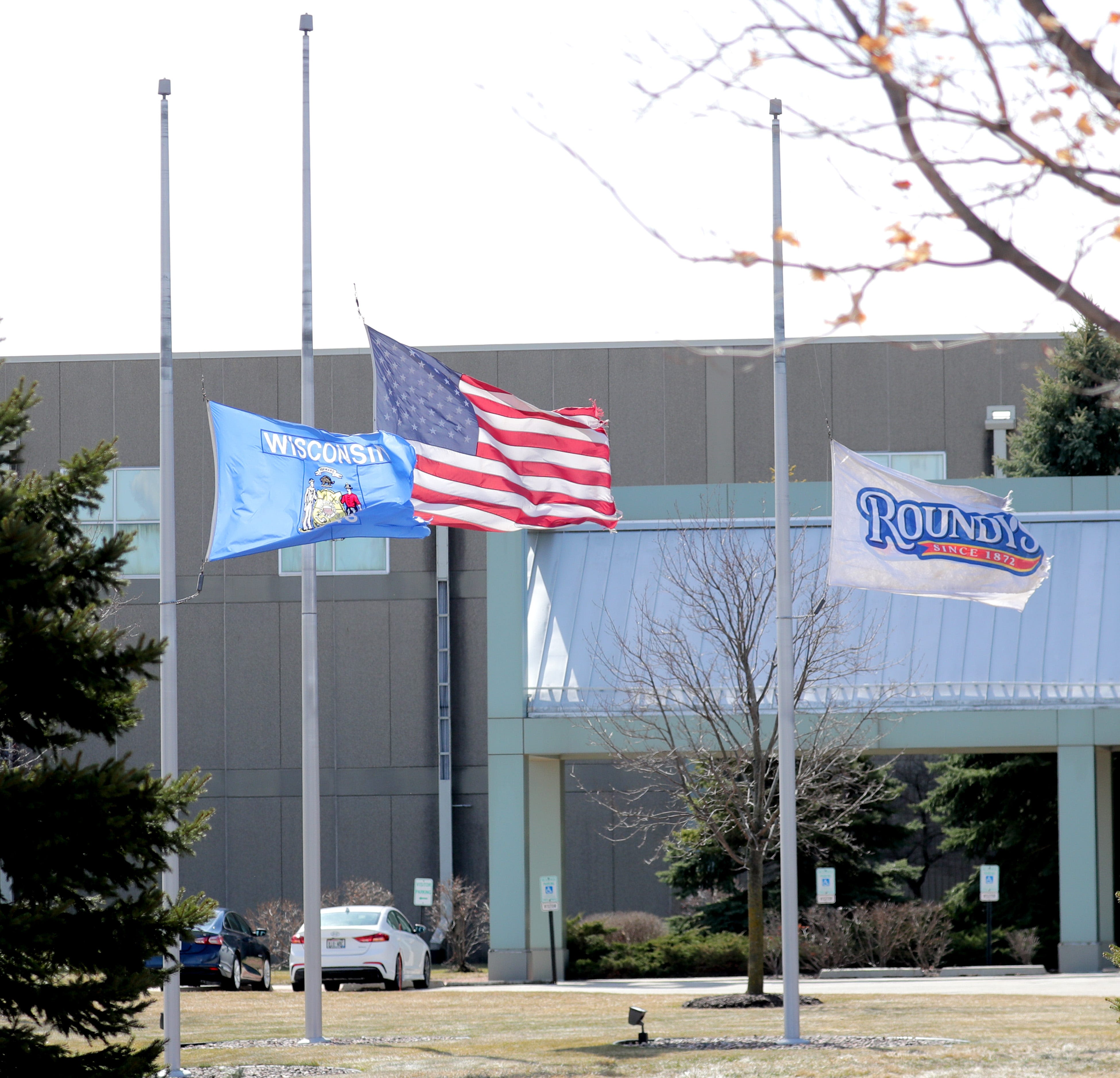 Why are the flags flying at half-staff in Wisconsin on Wednesday?