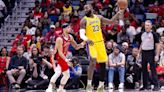 LeBron James, Lakers edge Pelicans, clinch playoff bid