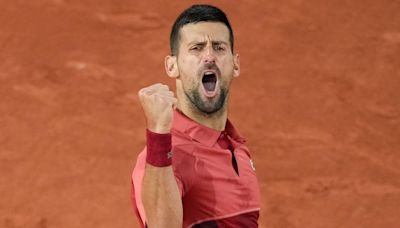 Novak Djokovic: Defending French Open champion up and running with victory over Pierre-Hugues Herbert