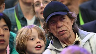 Mick Jagger and Son Deveraux, 7, Smile in the Stands as They Watch Fencing at the Paris Summer Olympics