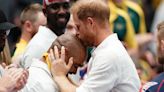 Harry kisses wheelchair rugby player on head at Invictus Games