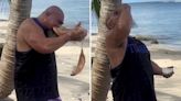 Watch boxing legend savagely eat a coconut as fans say 'my teeth hurt from this'